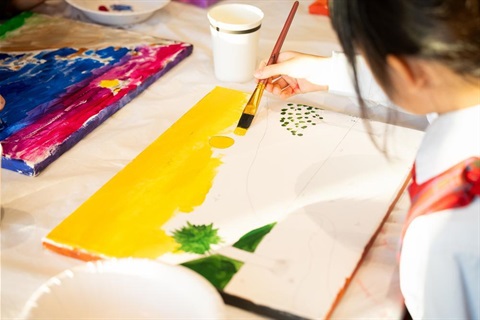 Young painter using bright colours