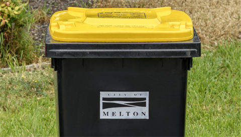 Recycling bin with yellow lid